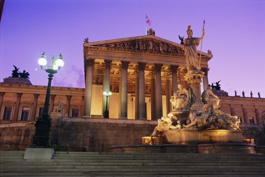 Pallas Athene (Athena) Fountain and Parliament building at night, Vienna, Austria, Europe