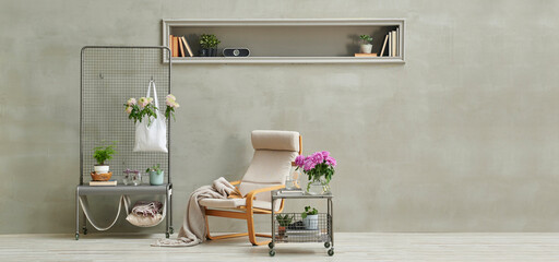 Grey stone wall background,niche, rocking chair, flower detail, home decoration style.