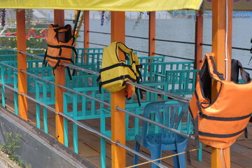 A life vest is attached to a boat for emergencies 