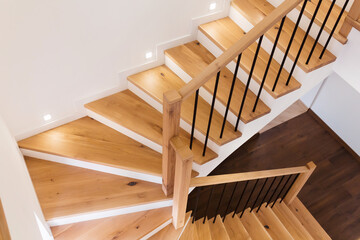 Wood staircase inside contemporary white modern house. - 417847573