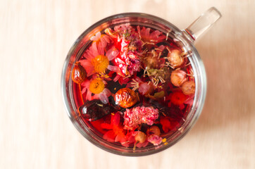 Close up photo of cup of hibiscus tea on the table in the morning