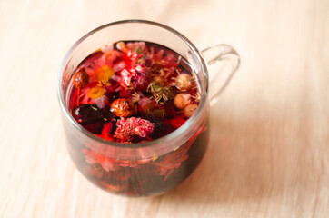 Close up photo of cup of hibiscus tea on the table in the morning