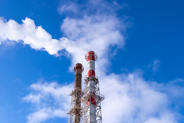Smoke coming from the chimney of a thermal power plant in St. Petersburg. The use of natural gas in...