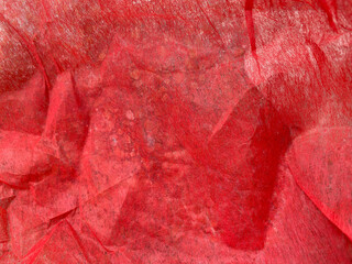 Close-up of natural red fabric or cloth in light red color. Fabric texture of natural cotton or linen textile material. Red canvas background for banner, cover book with copy space.........