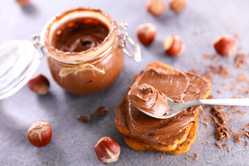 chocolate spread in jar and bread toast