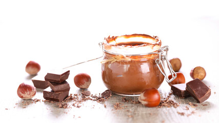 chocolate spread in jar and hazelnut