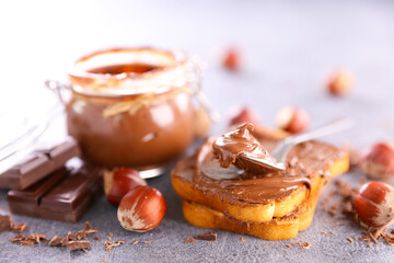chocolate spread in jar and bread toast