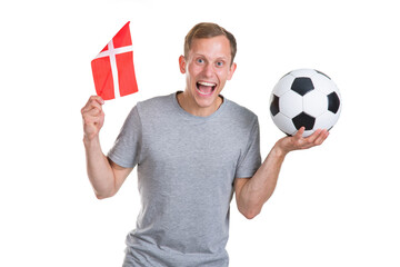 Young man with soccer ball and flag of Denmark. Sports soccer fan.