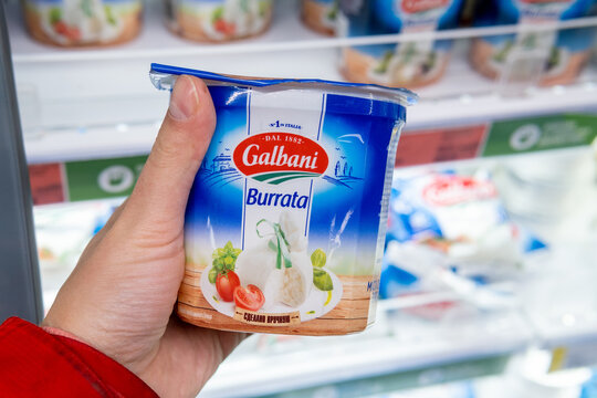 Tyumen, Russia-November 07, 2020: pack of Italian galbani buratta in the buyer hand