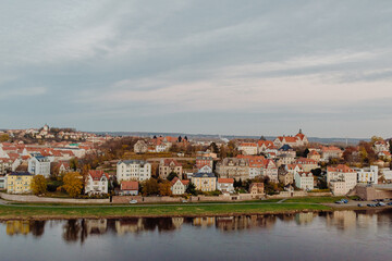 The red tile roofs of old European city Meissen on the embankment of river Elba