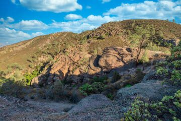 Rock formations in Pinnacles National Park in California, the destroyed remains of an extinct volcano on the San Andreas Fault. Beautiful landscapes, cozy hiking trails for tourists and travelers.