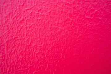 close up of red painted concrete wall texture or background
