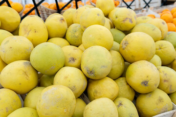 pomelo fruits are sold at the market. selective focus