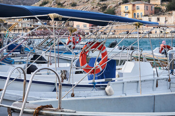 background - details of the structures of the boats standing in the harbor merge with each other