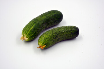 Fresh delicious ripe natural green cucumbers growing on a Ukrainian garden, vegetable garden, field. 