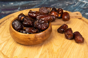 Dry date in a bowl. Ramadan Kareem with dates selective focus