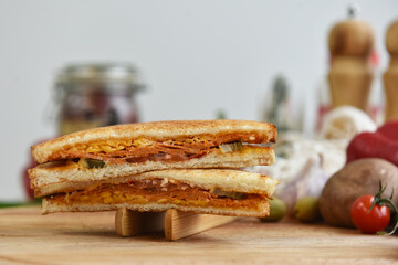 sandwich with white bread meat and vegetables