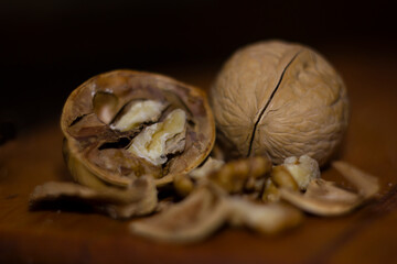 walnuts with shells on a wooden table