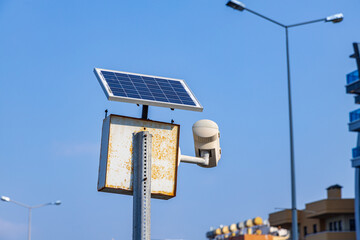 Solar powered camera monitoring system. Smart city part of video surveillance on the urban streets.