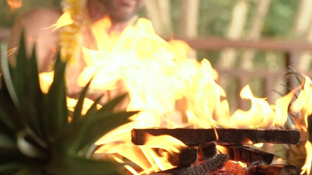 The priest pours ghee oil into the fire with a wooden spoon at the Yagya fire ceremony hindu traditional holy ritual. Slow motion