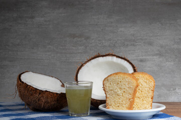 Cakes, pineapple and mint juice and coconut on the table.