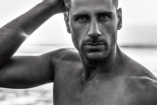 Beauty Portrait Of Handsome, Sexy Italian Man With Beard And Stunning Eyes Posing On The Beach