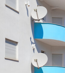 Balconies with satellite dishes