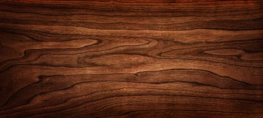 Poster Walnoot boom textuur close-up. Brede walnoot houtstructuur achtergrond. Walnootfineer wordt gebruikt in luxe afwerkingen. © Tryfonov
