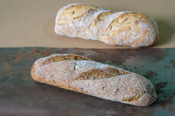 Two multi-grain mini baguettes made of wholemeal flour.