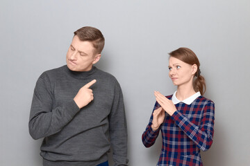 Portrait of couple talking, quarrelling and actively gesturing