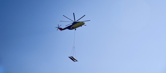 The world's largest cargo helicopter hovers overhead. Bottom view.