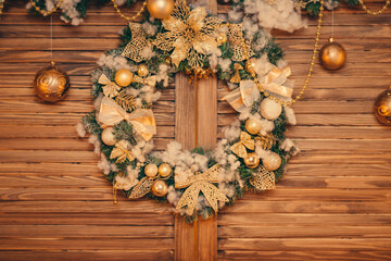 Christmas wreath on a rustic wooden front door or wall