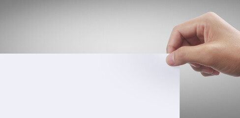 Obraz premium Hands holding white empty paper.