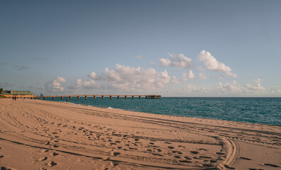 Fototapeta na wymiar beach sand sky blue pier beautiful place cloud horizon sunny isles florida usa vacation 