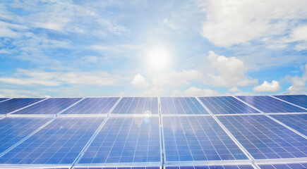 Photovoltaic panels installed on the toproof of the building, sunstainable energy concept. Selective and soft focus.