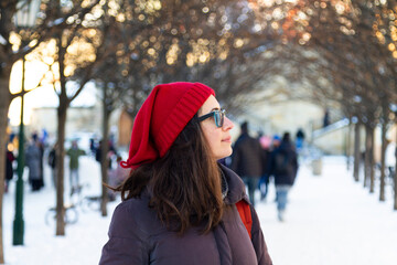 smilling woman in winter, woman with a red hat in  winter, woman with sunglasses