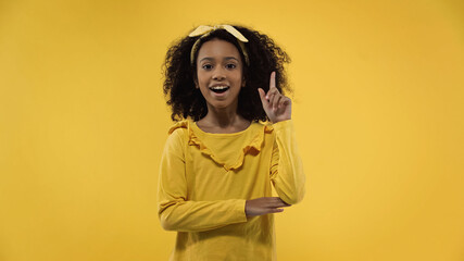 amazed african american girl having idea isolated on yellow