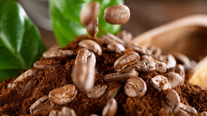 Falling Roasted Coffee Beans on Brown Background, close-up.