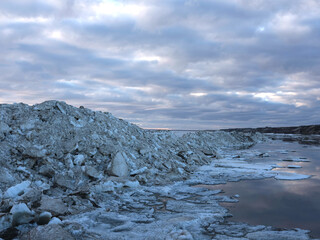 Spring coast of the Arctic Ocean. Beautiful sky and ice crystals. Artistic noise