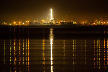 Fototapeta premium Night view of a port, industrial background , Industrial sea port of Lamchabang at night. Thailand