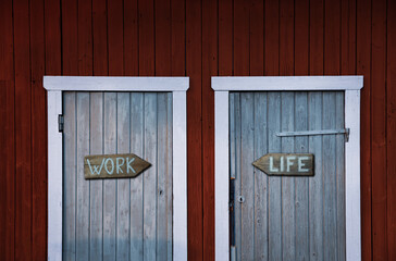 Work-life concept, two doors with indication, blue and red color, old wooden doors, life choices - 417876555