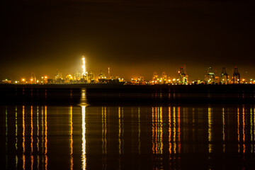 Fototapeta na wymiar Night view of a port, industrial background , Industrial sea port of Lamchabang at night. Thailand