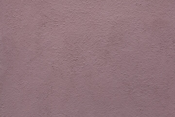 Dirty pink painted stucco wall. Background texture