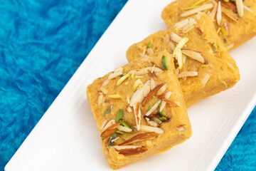 Indian Mithai Lachedar Patisa With Various Names Soan Papdi San Papdi Sohan Papdi Sukhdi Or Sonpapdi Son Roll Is Made Of Gram Wheat Flour Besan Kaju Pista Badam Dry Fruits Jaggery Fried In Desi Ghee