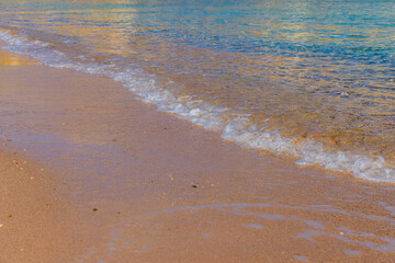 Closeup of the sand on beach and Red sea water