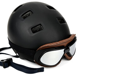 A black bike helmet with mirrored motorcycle goggles.
