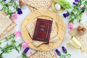 Pesah celebration concept (jewish Passover holiday). Traditional book with text in hebrew: Passover Haggadah (Passover Tale)