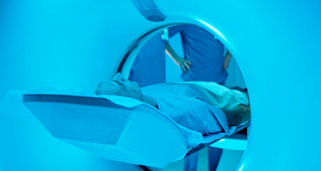 Fototapeta na wymiar End of CT scanning of elderly patient in clinic