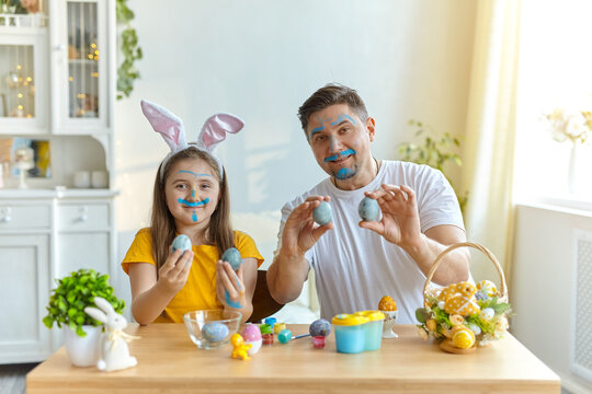 Father and daughter earing bunny ears for Easter