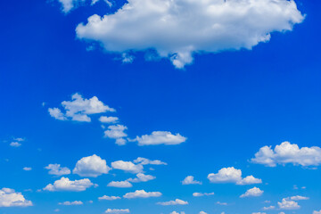 White fluffy clouds in the blue sky